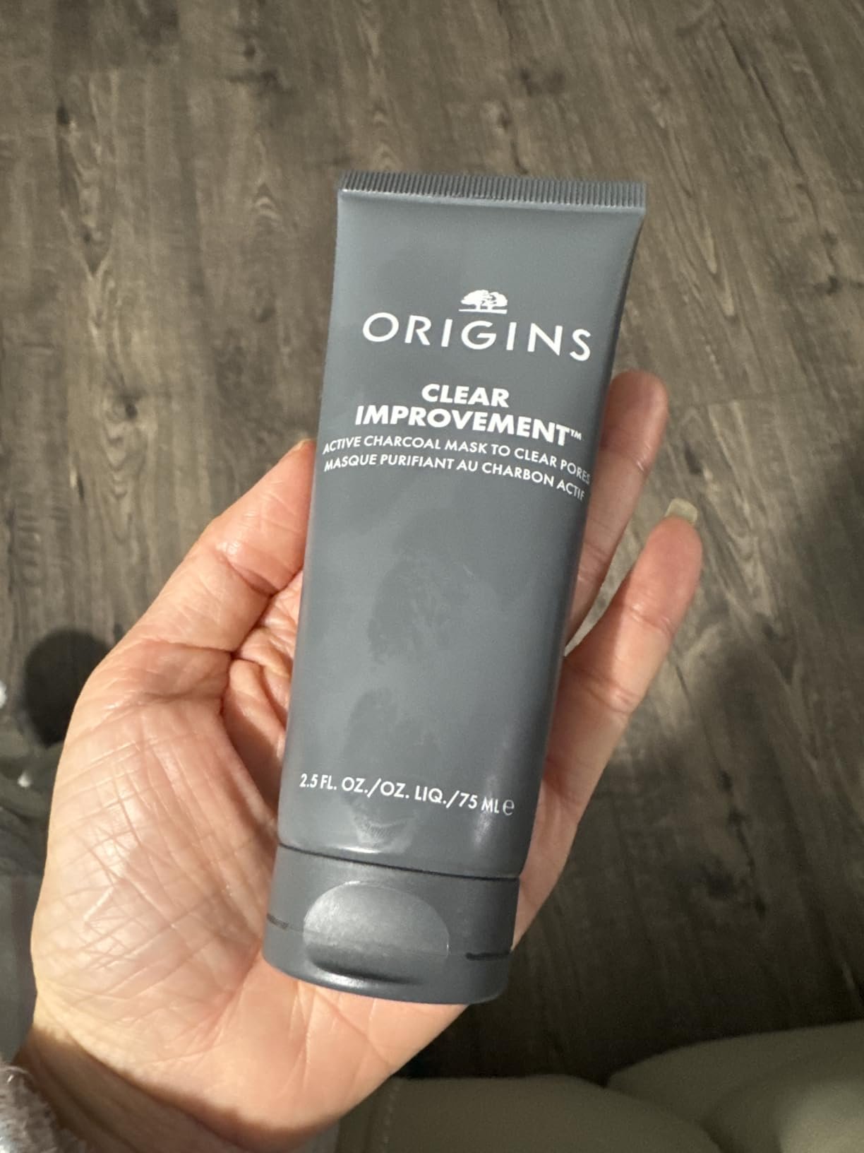 Origins Clear Improvement Active Charcoal Mask tube held in hand