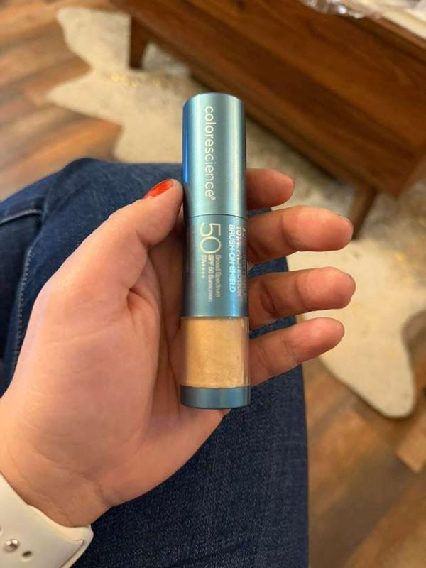 Colorescience Sunforgettable Brush-On Shield SPF 50 held in hand