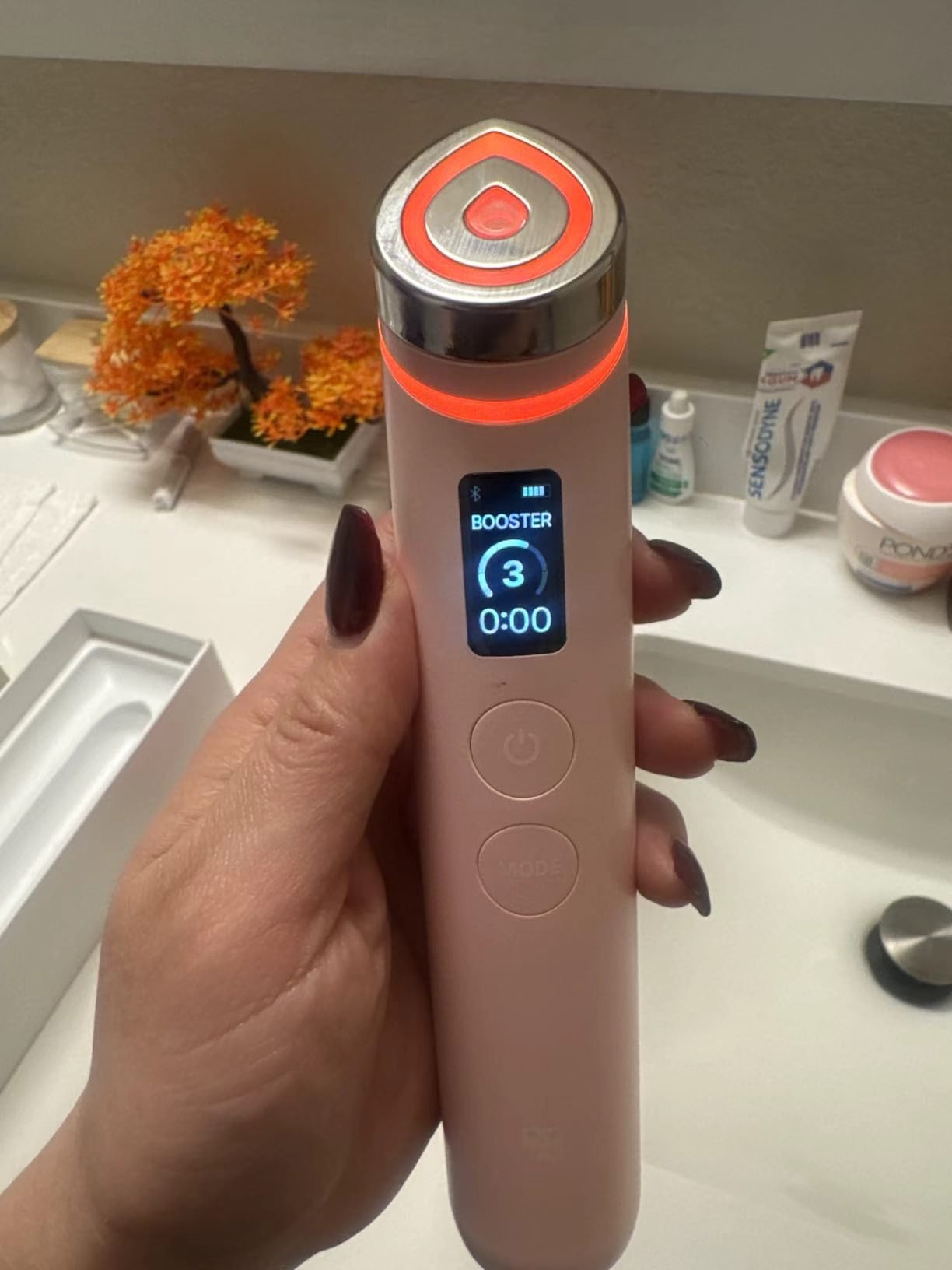 medicube Booster Pro handheld device showing Booster mode